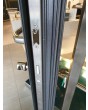 LIM M19 - puerta de entrada batiente de aluminio con textura de metal fresado niquelado dorado